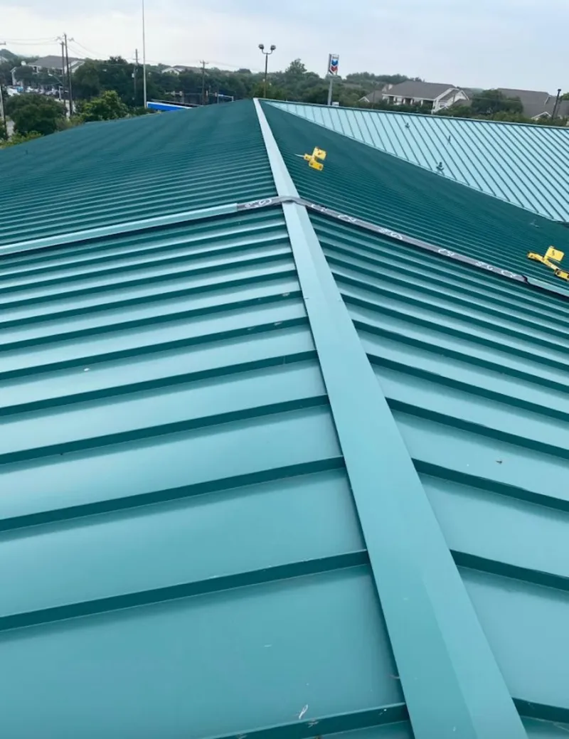 Green commercial metal roof ridge and valley for Metal Roof Repair in Northdale